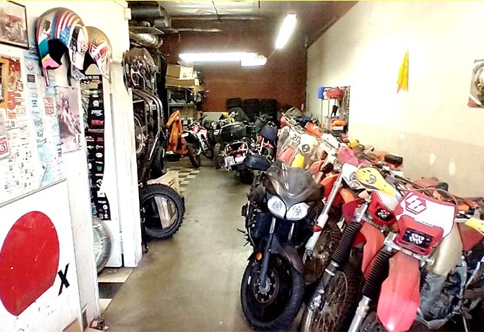 Inside MOTO WHOOPS, a Japanese-owned motorcycle shop in Gardena, lined with bikes