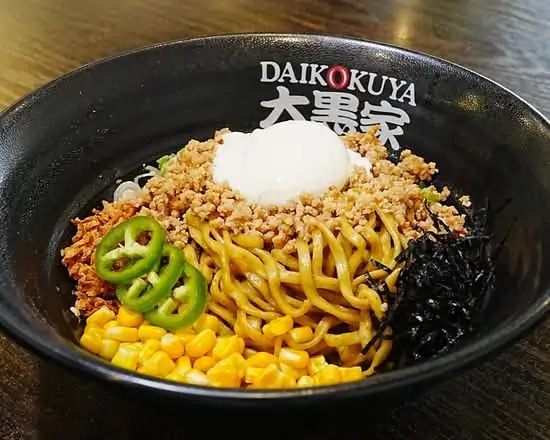 Daikokuya spicy chili mazemen topped with ground pork, corn, jalapeno, and a poached egg